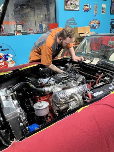 Working on a car at D&C Classic Garage.