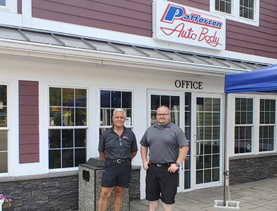 two-men-outside-body-shop