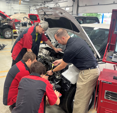 people-working-on-car