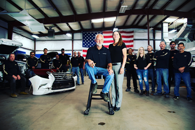 man-on-stool-surrounded-by-people