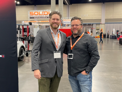 Cole Strandberg of FOCUS Investment Banking, left, and Jake Rodenroth of Lucid Motors, right, walk t